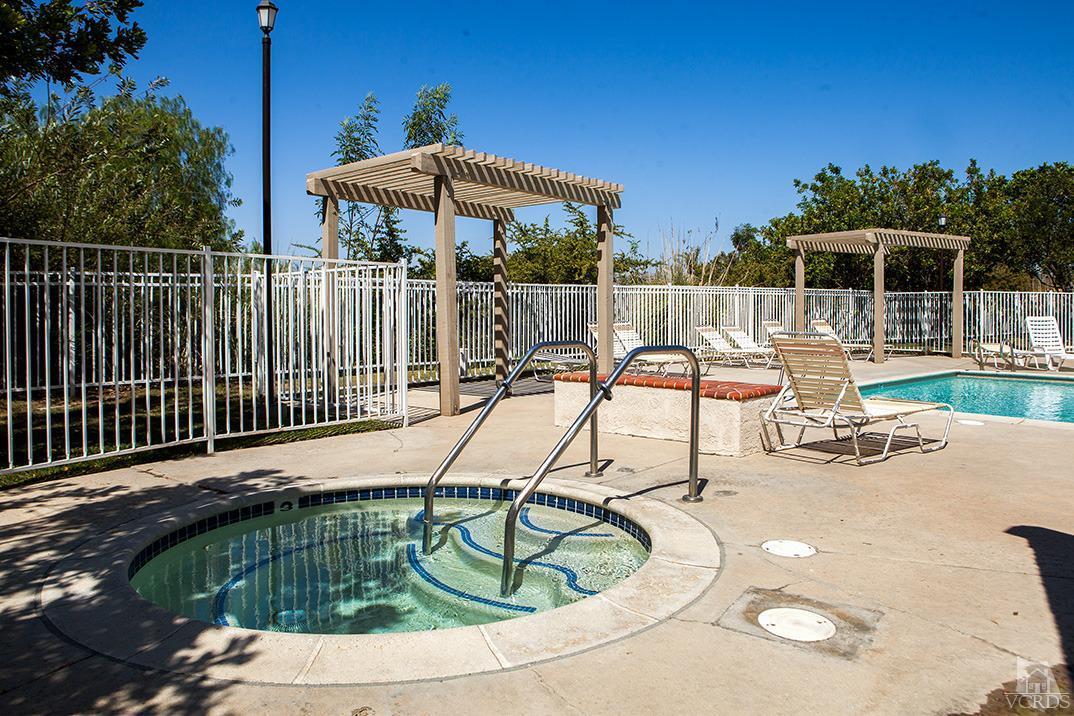 1175 Fitzgerald Road, Unit A Simi Valley, CA 93065 - Photo 15 of 16 a view of a patio with a table chairs and a fire pit