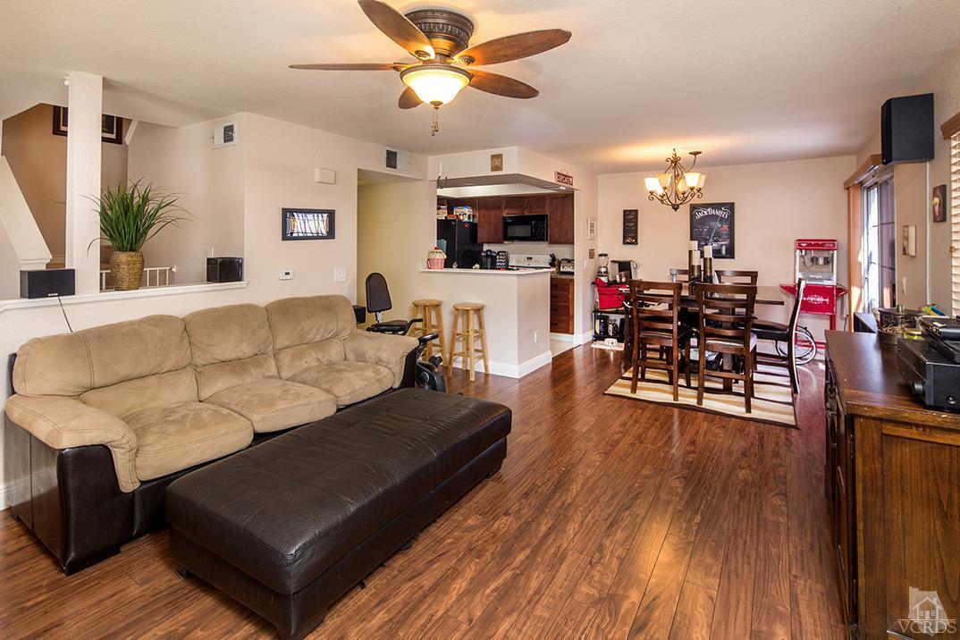 1175 Fitzgerald Road, Unit A Simi Valley, CA 93065 - Photo 3 of 16 a living room with furniture kitchen view and a wooden floor