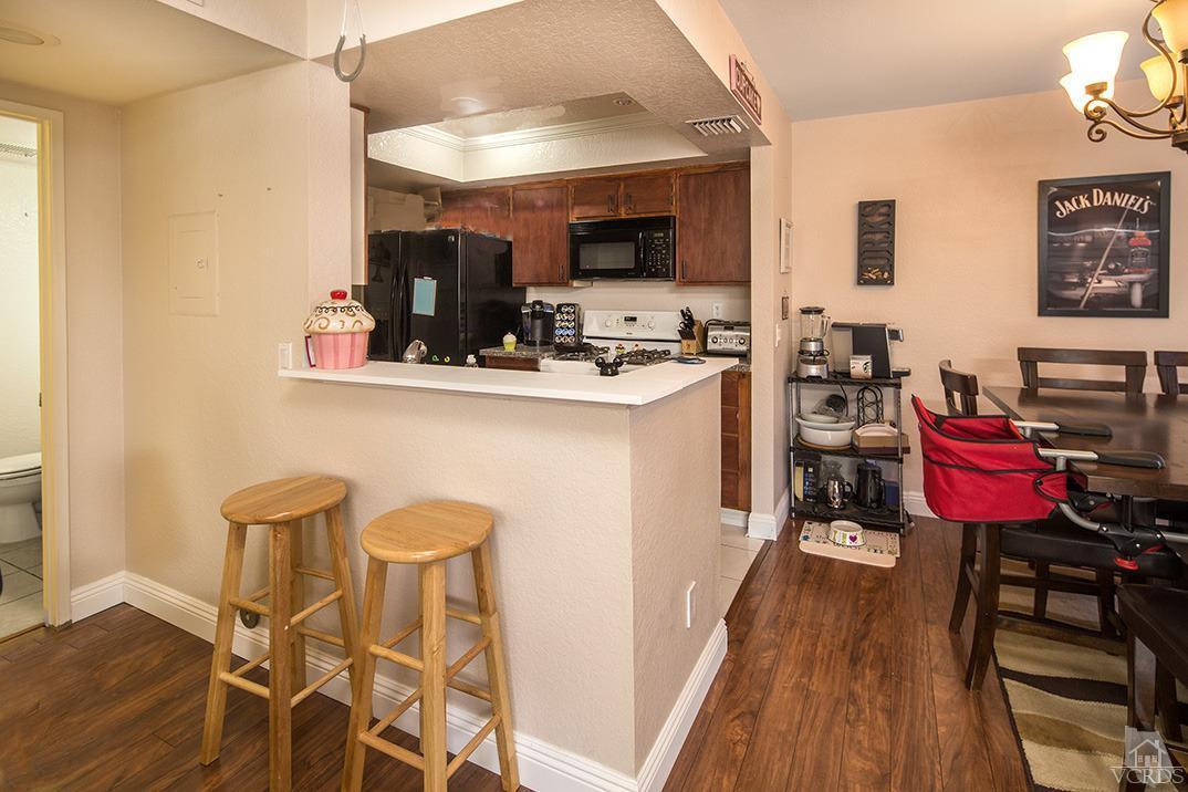 1175 Fitzgerald Road, Unit A Simi Valley, CA 93065 - Photo 7 of 16 a kitchen with a sink cabinets and wooden floor