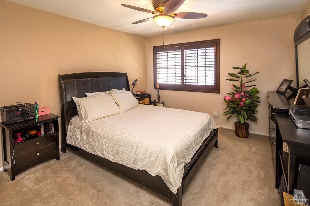 1175 Fitzgerald Road, Unit A Simi Valley, CA 93065 - Photo 10 of 16 a bedroom with a bed and a potted plant