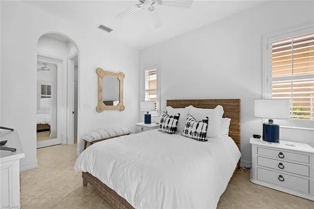 a bathroom with a shower a sink a toilet and a mirror