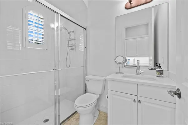 a living room with couch and a floor to ceiling window