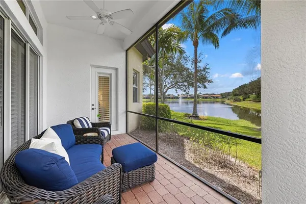 a view of a chair and tables in the balcony