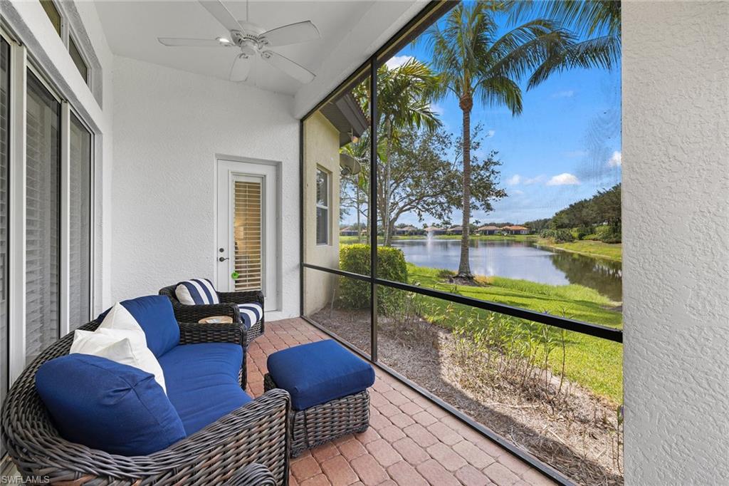 7785 Ashton Road Naples, FL 34113 - Photo 26 of 39 a outdoor living space with furniture and a potted plant