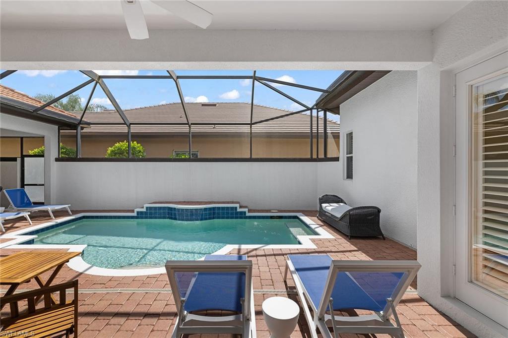 7785 Ashton Road Naples, FL 34113 - Photo 28 of 39 a view of yard from outdoor seating