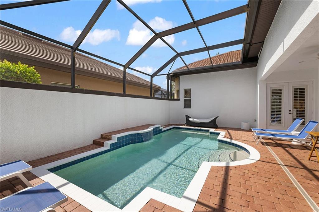 7785 Ashton Road Naples, FL 34113 - Photo 31 of 39 a view of swimming pool with seating area