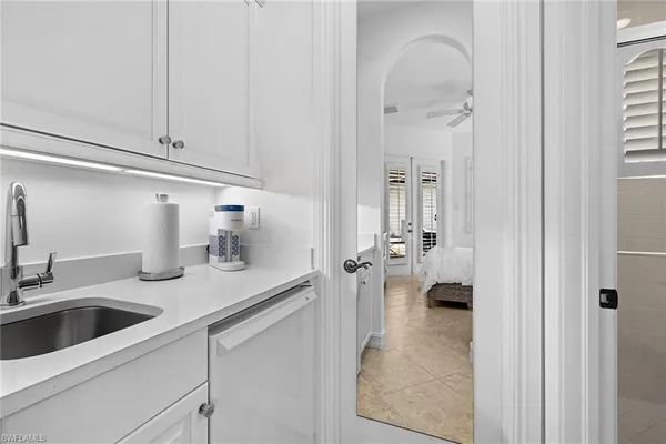 a view of a lake with houses in the back