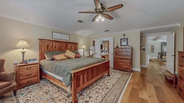 a bedroom with a bed and dresser