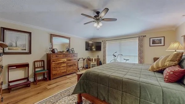 a spacious bathroom with a tub sink and mirror