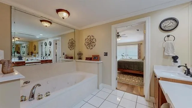 a bedroom with a bed a dresser and book shelf