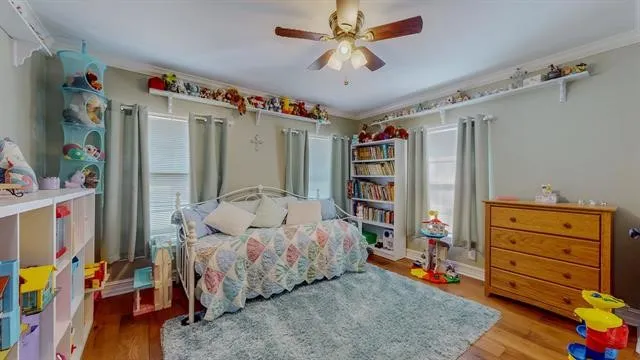 a living room with furniture and a book shelf