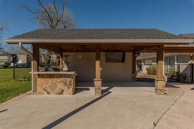 a view of a field with trees in the background
