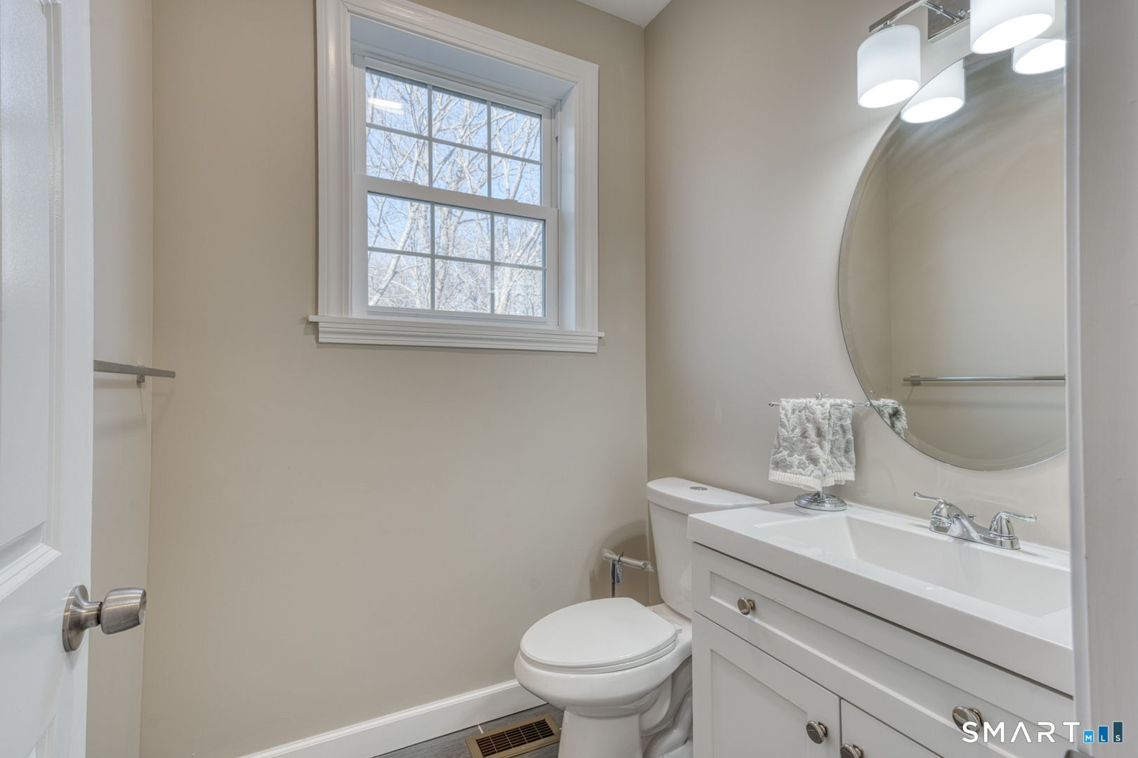 205 Winding Hollow Road Groton, CT 06340 - Photo 12 of 27 a bathroom with a granite countertop toilet sink and mirror