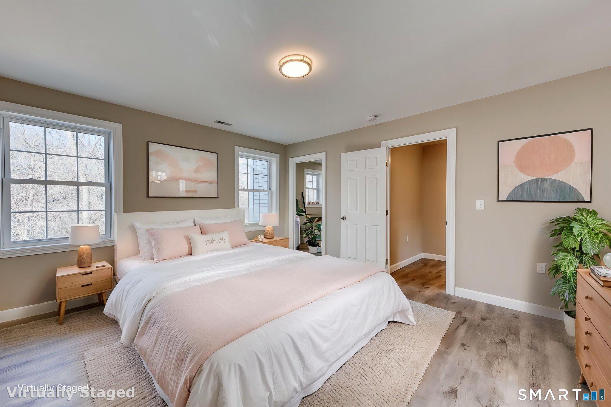 205 Winding Hollow Road Groton, CT 06340 - Photo 15 of 27 a bedroom with a bed and a window