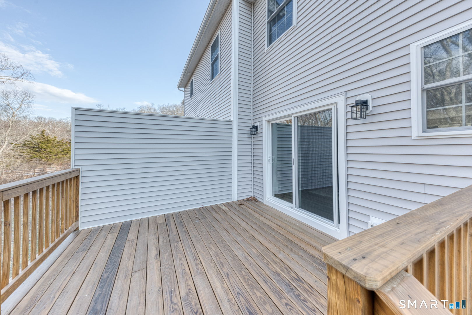 205 Winding Hollow Road Groton, CT 06340 - Photo 2 of 27 a view of a house with wooden deck