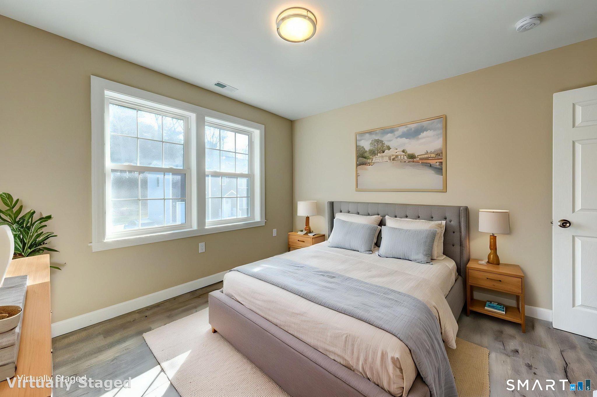 205 Winding Hollow Road Groton, CT 06340 - Photo 25 of 27 a bedroom with a bed and a window