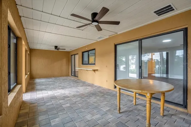 a view of livingroom with kitchen island furniture and a chandelier