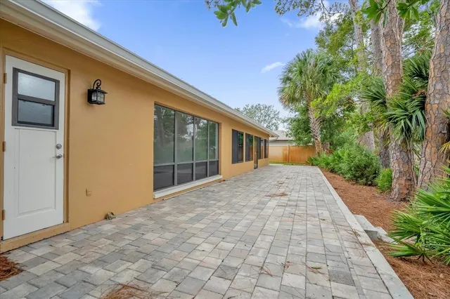 a view of a house with a backyard