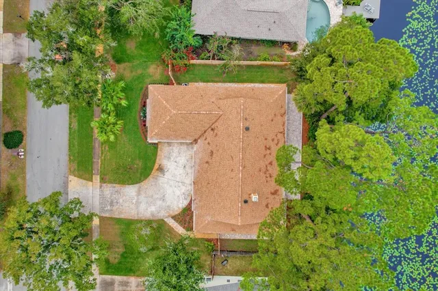an aerial view of a house with a garden