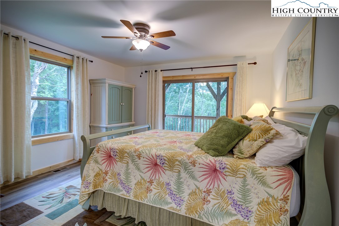 111 Boca Ridge Road Boone, NC 28607 - Photo 28 of 44 a bedroom with a large bed and a window