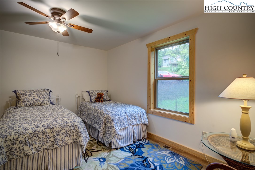 111 Boca Ridge Road Boone, NC 28607 - Photo 31 of 44 a bedroom with two beds and a window