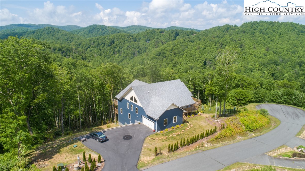 111 Boca Ridge Road Boone, NC 28607 - Photo 44 of 44 an aerial view of a house with a garden and lake view