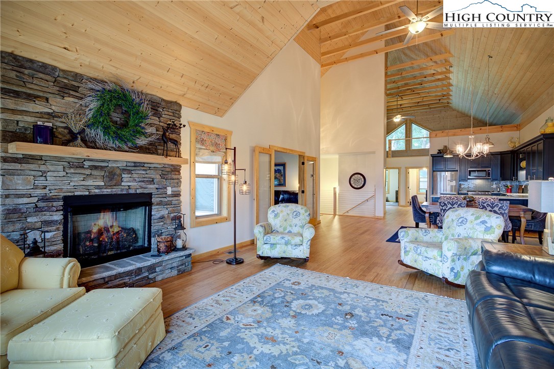 111 Boca Ridge Road Boone, NC 28607 - Photo 5 of 44 a living room with furniture and a fireplace
