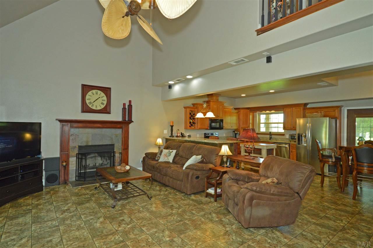 5611 Rolyat Road Pace, FL 32571 - Photo 7 of 46 Open to kitchen and 2 story ceilings