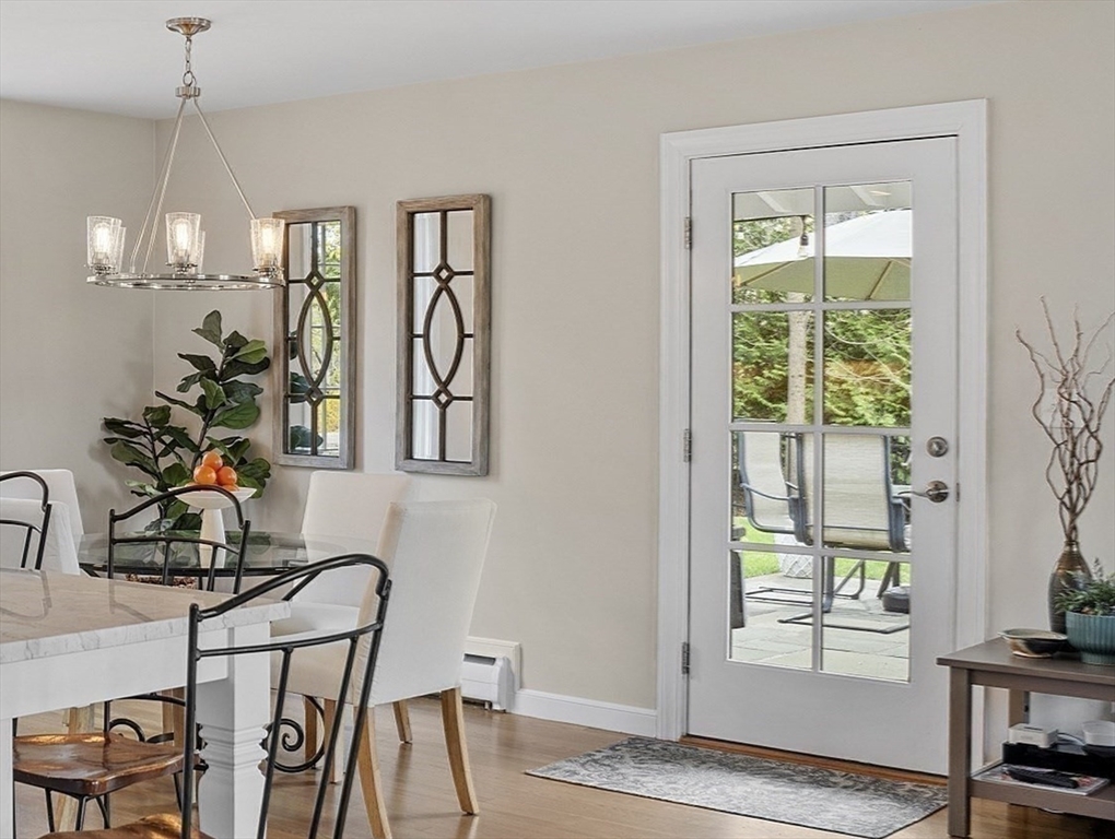 3 B Pelham Road Lexington, MA 02421 - Photo 14 of 41 a view of a dining room with furniture and a window