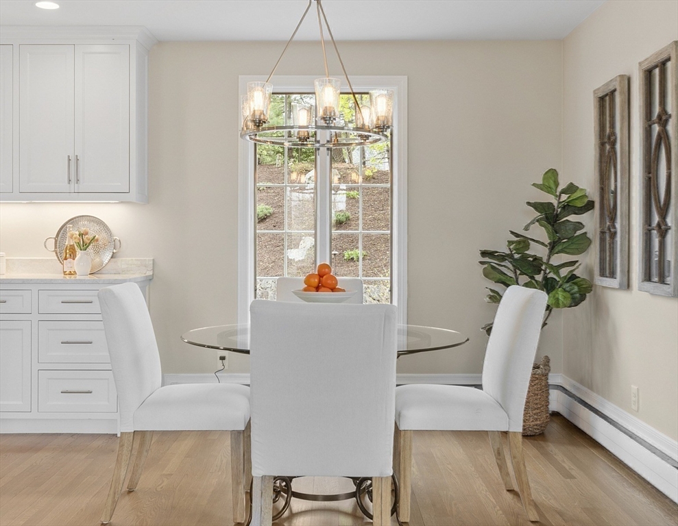 3 B Pelham Road Lexington, MA 02421 - Photo 15 of 41 a hallway with a dining table chair and a potted plant