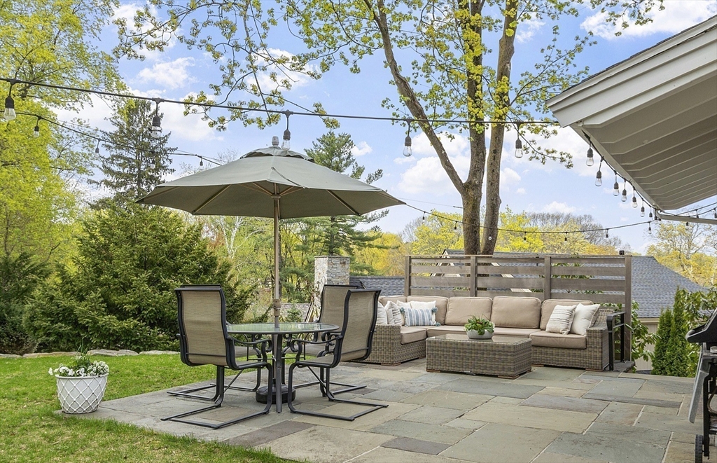 3 B Pelham Road Lexington, MA 02421 - Photo 16 of 41 a patio with tables and chairs