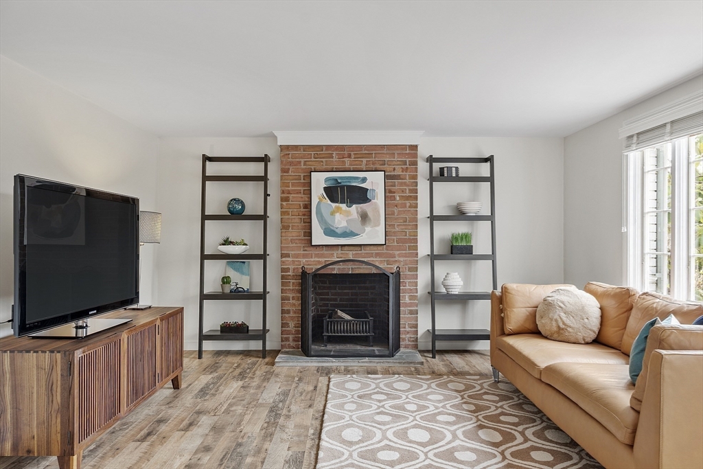 3 B Pelham Road Lexington, MA 02421 - Photo 28 of 41 a living room with furniture and a flat screen tv