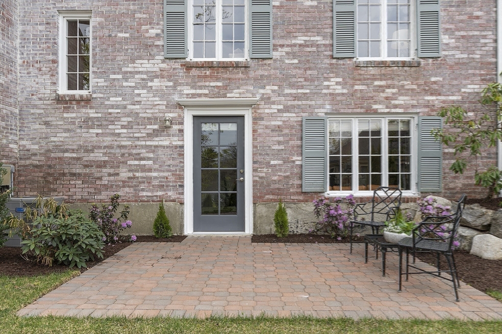 3 B Pelham Road Lexington, MA 02421 - Photo 30 of 41 a front view of a house with outdoor seating and plants