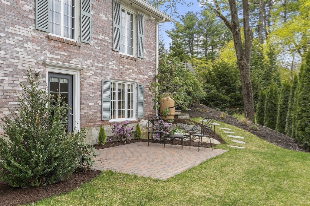 3 B Pelham Road Lexington, MA 02421 - Photo 31 of 41 a front view of a house with trees and plants