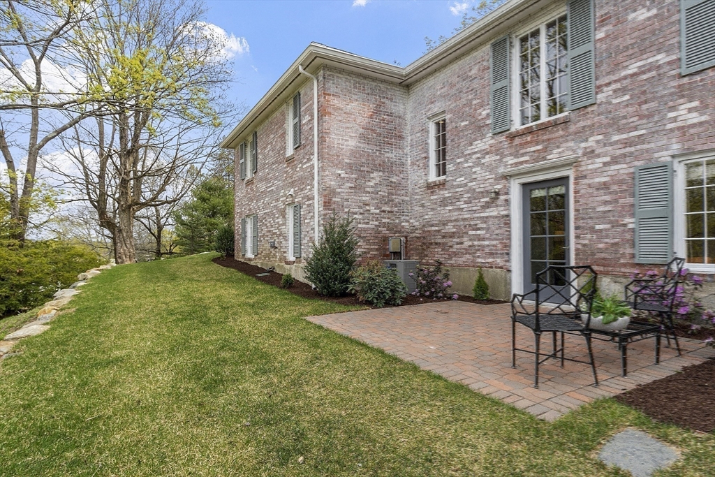 3 B Pelham Road Lexington, MA 02421 - Photo 32 of 41 a view of patio with a table and chairs and potted plants