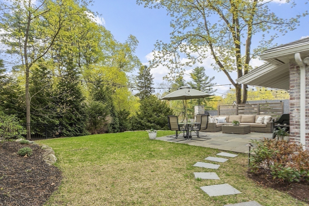 3 B Pelham Road Lexington, MA 02421 - Photo 35 of 41 a swimming pool with outdoor seating and yard