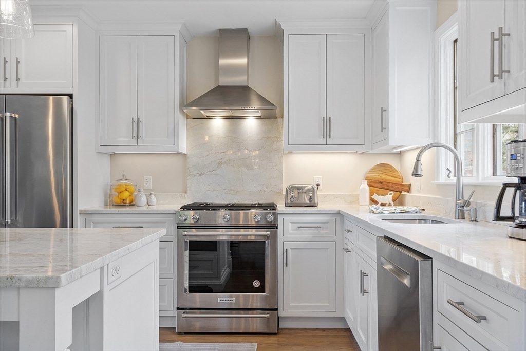 3 B Pelham Road Lexington, MA 02421 - Photo 6 of 41 a kitchen with stainless steel appliances granite countertop a sink stove and refrigerator