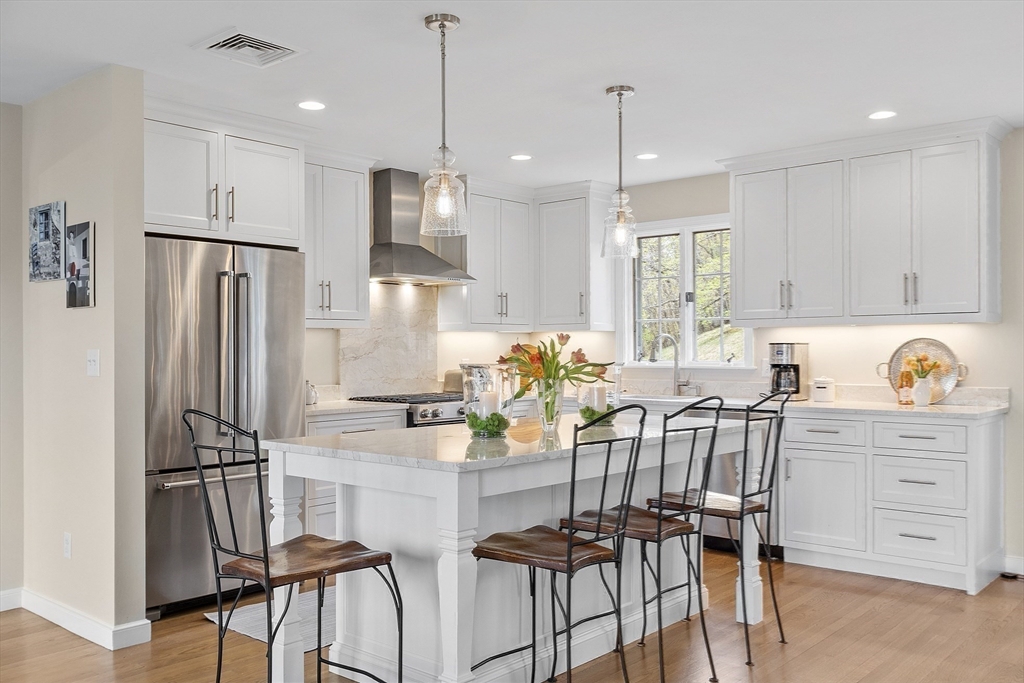 3 B Pelham Road Lexington, MA 02421 - Photo 7 of 41 a kitchen with granite countertop a refrigerator and a stove top oven