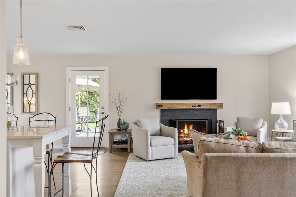3 B Pelham Road Lexington, MA 02421 - Photo 10 of 41 a living room with furniture and a flat screen tv