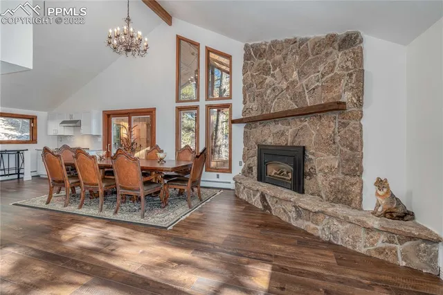 a living room with furniture a window and a fireplace