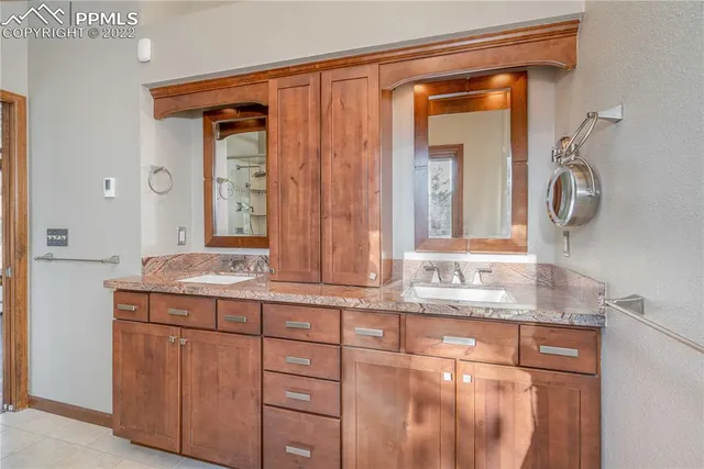 a view of an empty room with a fireplace and a window
