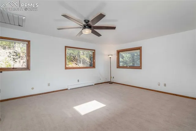 a view of an empty room with a window