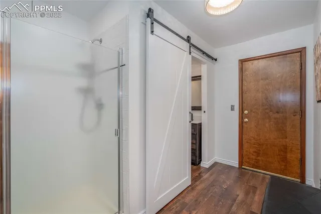 a bathroom with a toilet and a shower