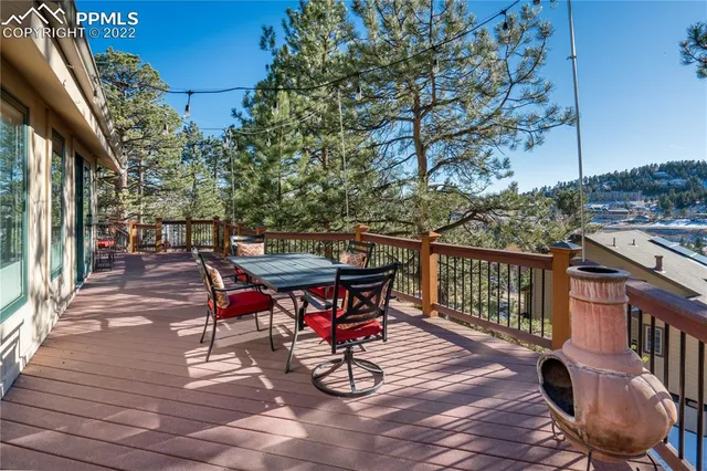a view of a chairs and table on the wooden floor