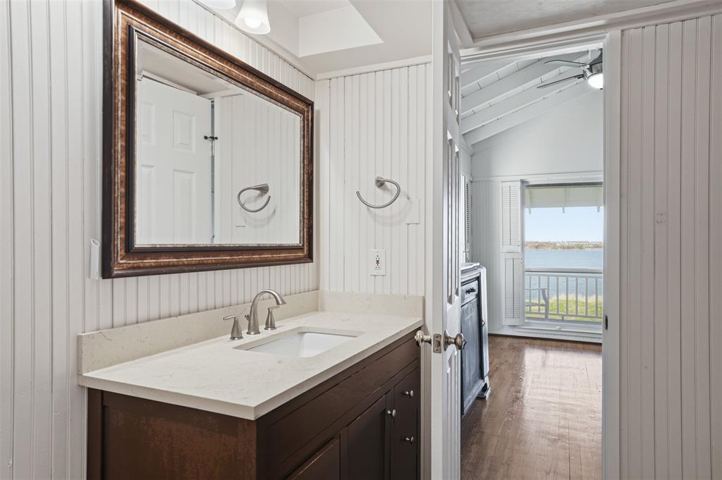 13280 Beach Club Road The Colony, TX 75056 - Photo 21 of 40 a bathroom with a sink a vanity and a mirror