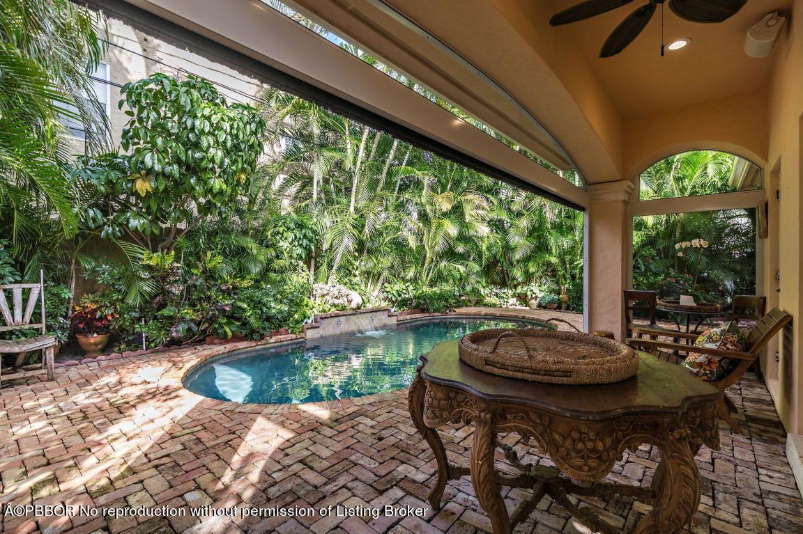 309 Valencia Road West Palm Beach, FL 33401 - Photo 19 of 24 a living room with yard and outdoor seating