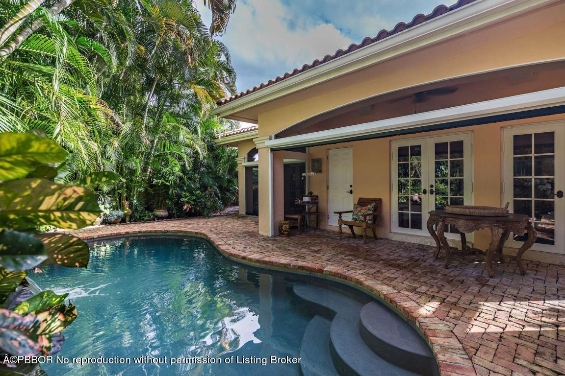 309 Valencia Road West Palm Beach, FL 33401 - Photo 20 of 24 a swimming pool with outdoor seating and yard