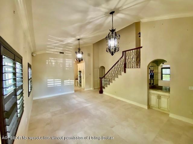 309 Valencia Road West Palm Beach, FL 33401 - Photo 3 of 24 a view of a hallway with a white walls and stairs