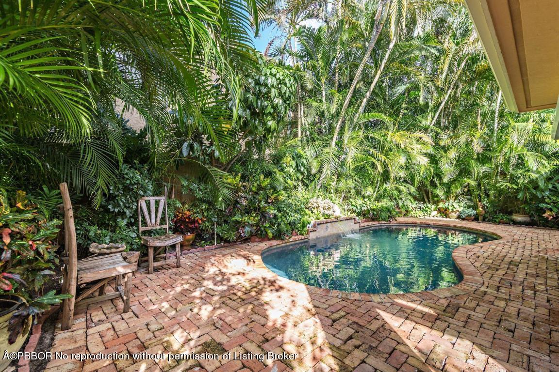 309 Valencia Road West Palm Beach, FL 33401 - Photo 21 of 24 a view of a chair with sitting area in back yard