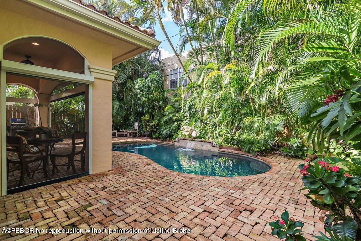 309 Valencia Road West Palm Beach, FL 33401 - Photo 22 of 24 a kitchen with swimming pool and porch